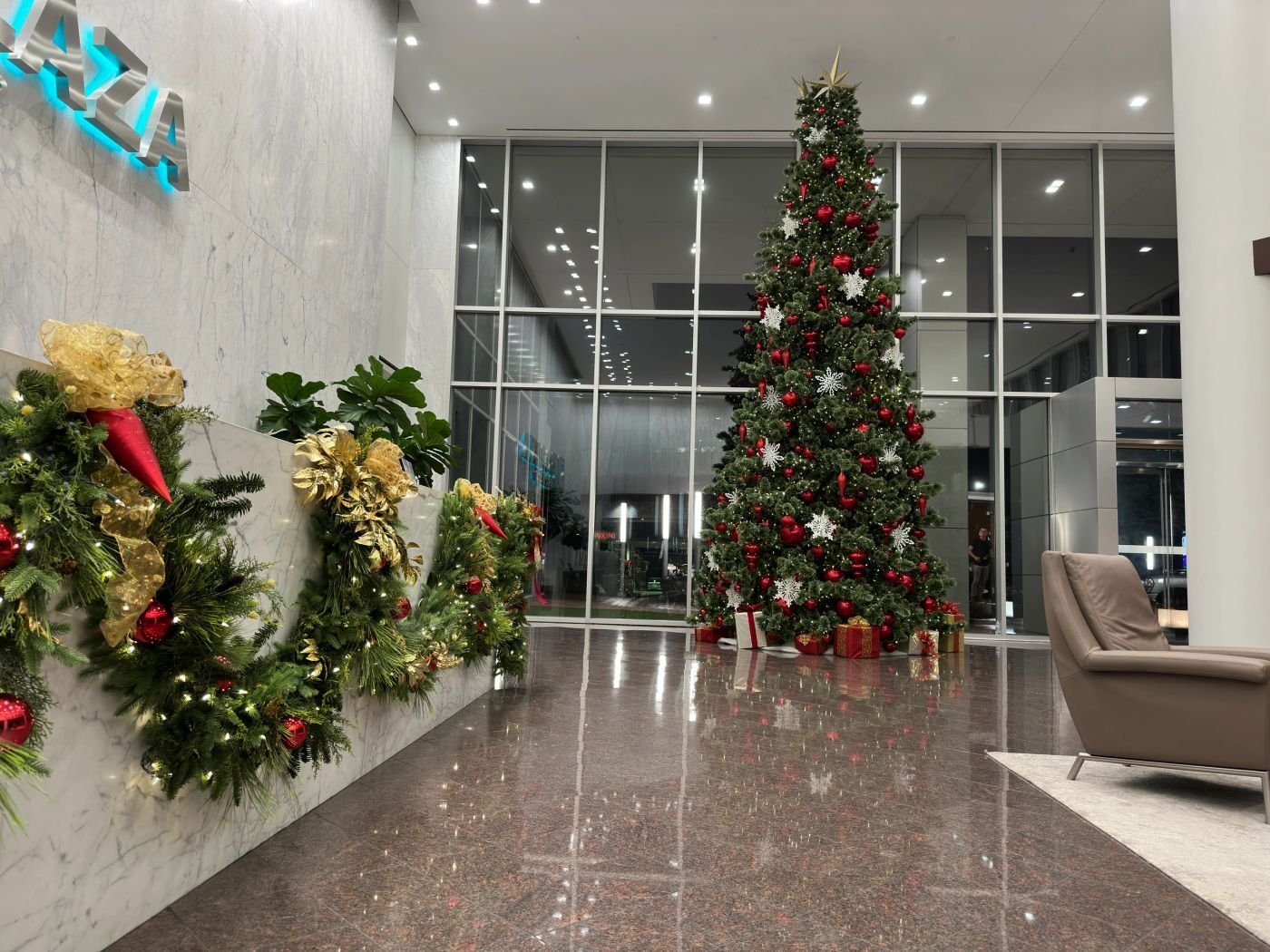Commercial lobby with a towering professionally decorated Christmas tree