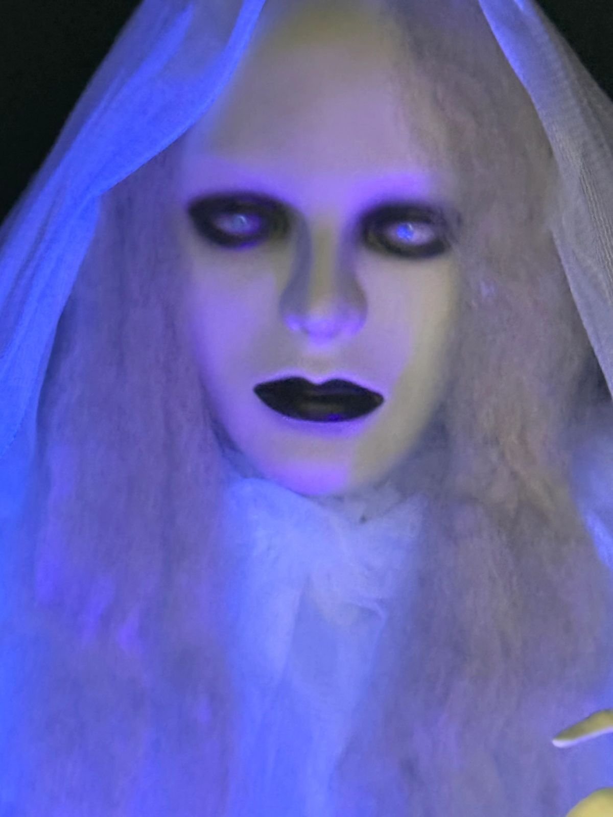 Illuminated ghost figure in a Halloween installation